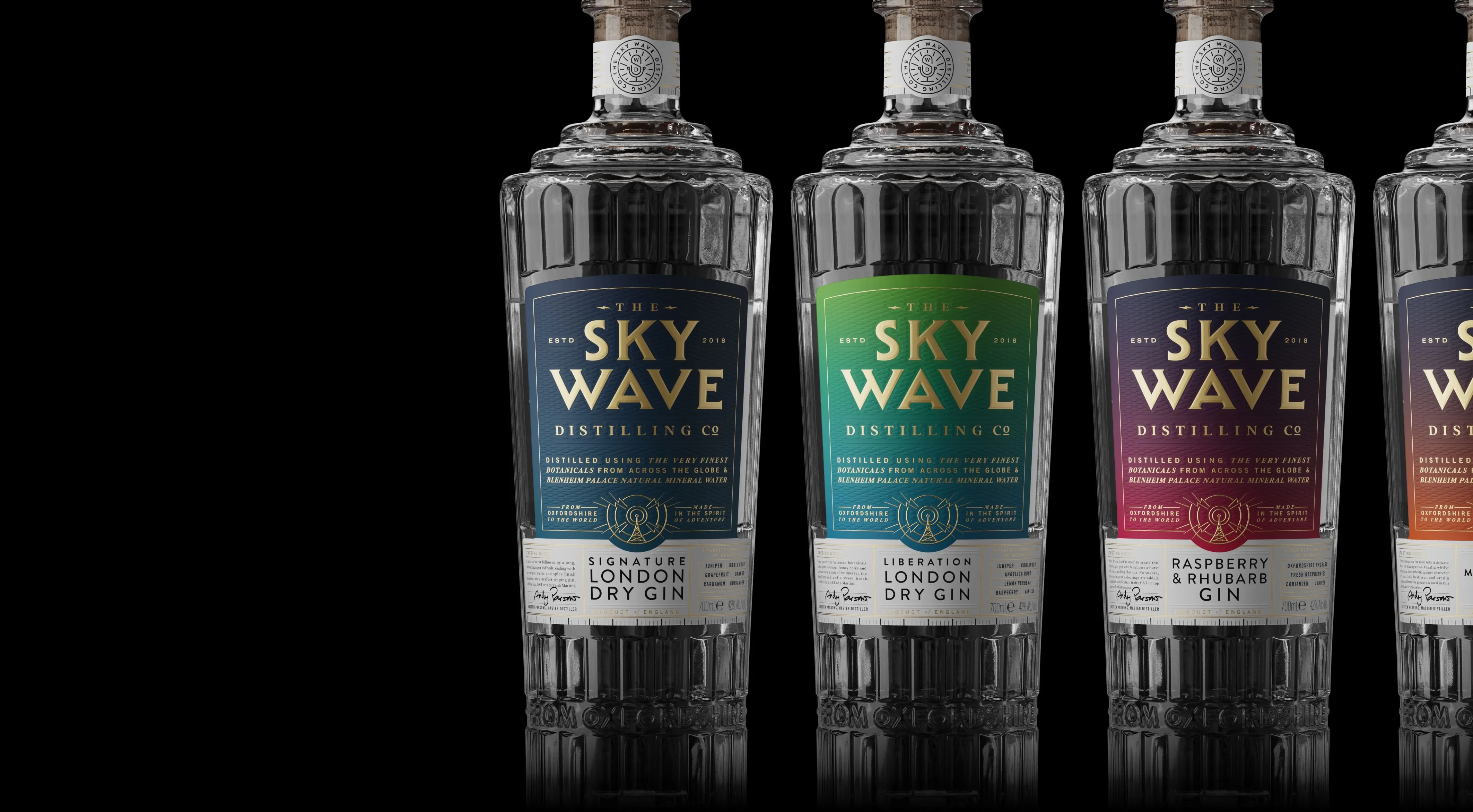 The Sky Wave London Dry Gin, 5 elegant glass bottles on a black background, labelled: Signature, liberation, raspberry & rhubarb, orange & madagascan vanilla, and old tom